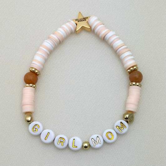 Broadway Stacks Motherlode Special Edition bracelets. Stretch bracelets. Greens, browns, white and gold colored beads. Letter beads that spell Motherlode, Boy Mom, Girl Mom, Twin Mom.