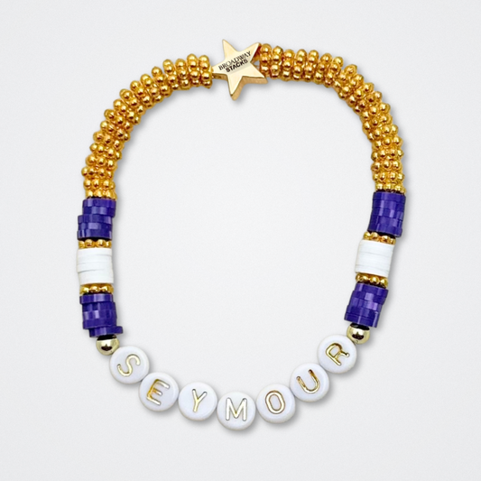 Broadway Stacks QUEEN collection. Stretch bracelets included in Stack. Gold, yellow, green, white, red, pink and blue colored beads. Letter beads that spell each queen. Also Herstory collection. Broadway Stacks gold star logo bead to remind you that You Shine. SIX the Musical fans.