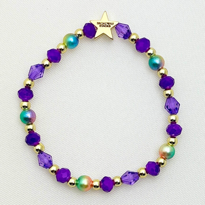 Broadway Stacks BroadwayCon X 2025 Star To Be bracelet. 1 stretch bracelet. Purple, gold and iridescent colored beads.