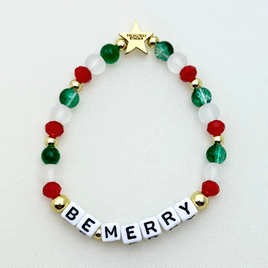 Broadway Stacks CHRISTMAS Collection. 5 stretch bracelets included in Stack. Red, green, white and gold colored beads. Letter beads that spell quotes. Gold star logo bead to remind you that you shine.