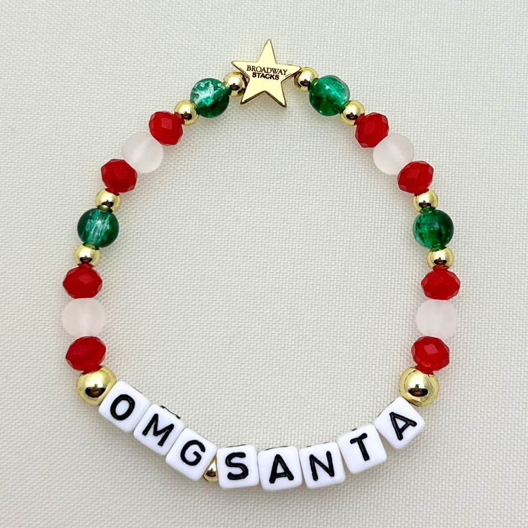 Broadway Stacks CHRISTMAS Collection. 5 stretch bracelets included in Stack. Red, green, white and gold colored beads. Letter beads that spell quotes. Gold star logo bead to remind you that you shine.