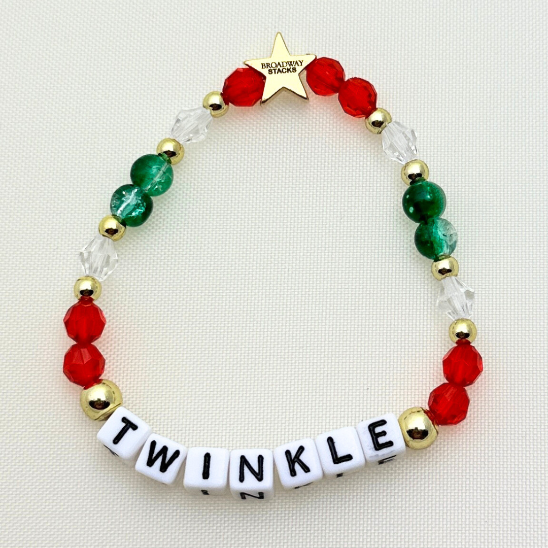 Broadway Stacks CHRISTMAS Collection. 4 stretch bracelets included in Stack. Red, green, white and gold colored beads. Letter beads that spell quotes. Gold star logo bead to remind you that you shine.