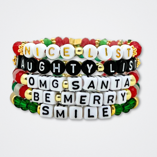 Broadway Stacks CHRISTMAS ELF Collection. Coordinating bead bracelets included in Stack. Red, green, white and gold colored beads. Letter beads that spell quotes. Gold star logo bead to remind you that you shine. Elf the Musical and Christmas holiday fans.