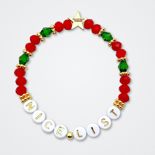 Broadway Stacks CHRISTMAS ELF Collection. Coordinating bead bracelets included in Stack. Red, green, white and gold colored beads. Letter beads that spell quotes. Gold star logo bead to remind you that you shine. Elf the Musical and Christmas holiday fans.