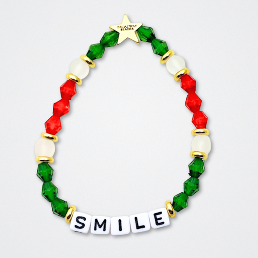 Broadway Stacks CHRISTMAS ELF Collection. Coordinating bead bracelets included in Stack. Red, green, white and gold colored beads. Letter beads that spell quotes. Gold star logo bead to remind you that you shine. Elf the Musical and Christmas holiday fans.