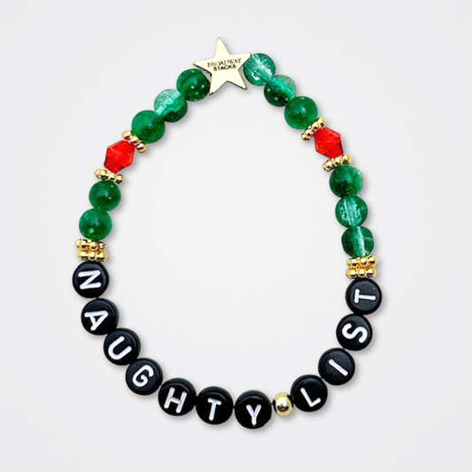 Broadway Stacks CHRISTMAS ELF Collection. Coordinating bead bracelets included in Stack. Red, green, white and gold colored beads. Letter beads that spell quotes. Gold star logo bead to remind you that you shine. Elf the Musical and Christmas holiday fans.