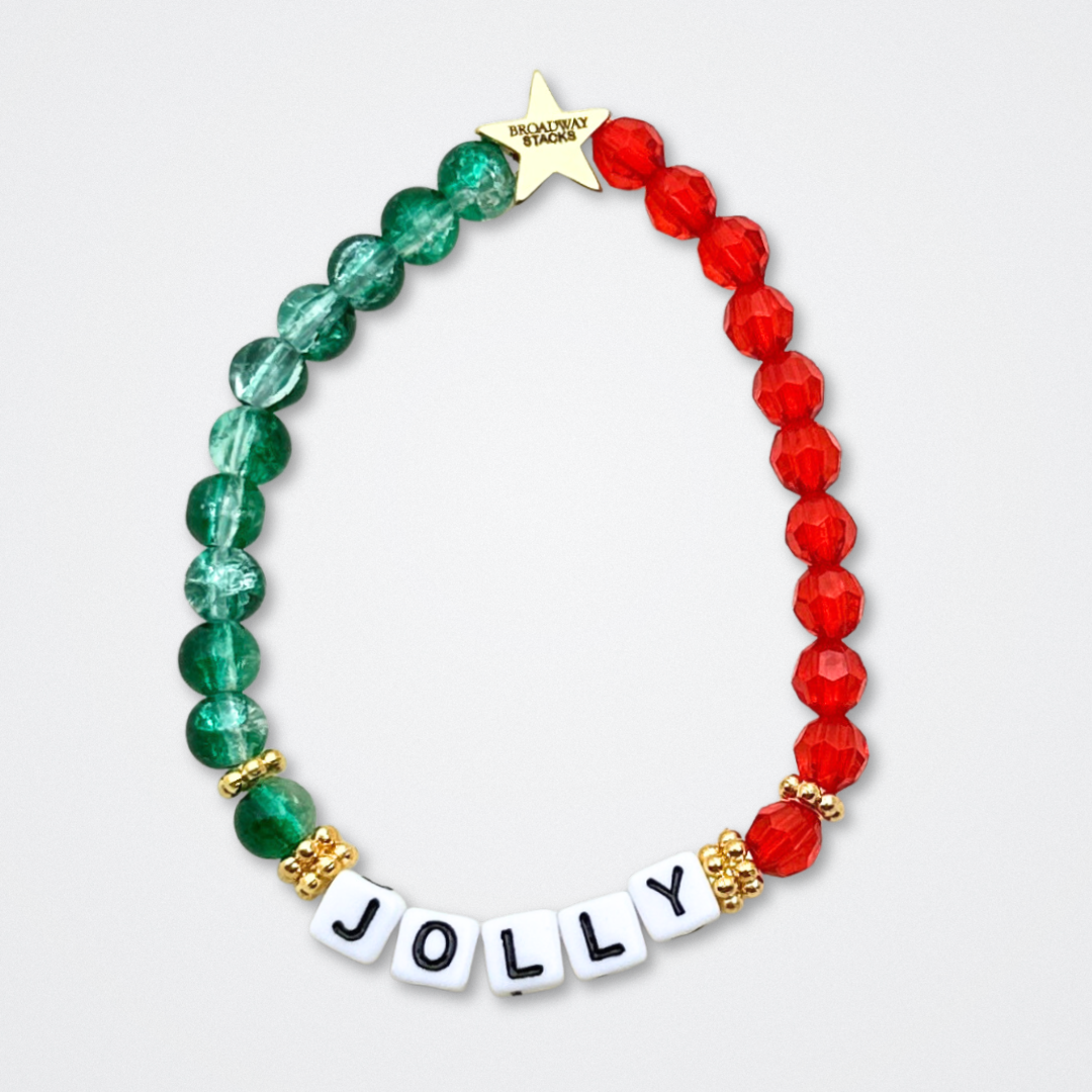 Broadway Stacks CHRISTMAS ELF Collection. Coordinating bead bracelets included in Stack. Red, green, white and gold colored beads. Letter beads that spell quotes. Gold star logo bead to remind you that you shine. Elf the Musical and Christmas holiday fans.