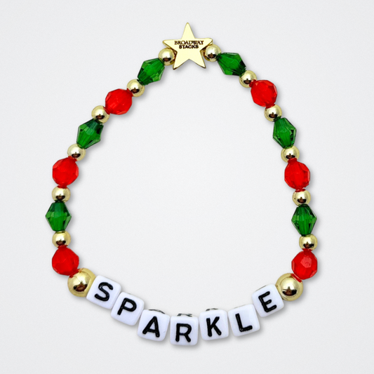Broadway Stacks CHRISTMAS ELF Collection. Coordinating bead bracelets included in Stack. Red, green, white and gold colored beads. Letter beads that spell quotes. Gold star logo bead to remind you that you shine. Elf the Musical and Christmas holiday fans.