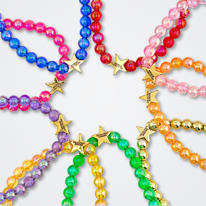 Broadway Stacks colorful beaded bracelets displayed on a light gray background. Each bracelet has star logo bead to remind you that... YOU SHINE.