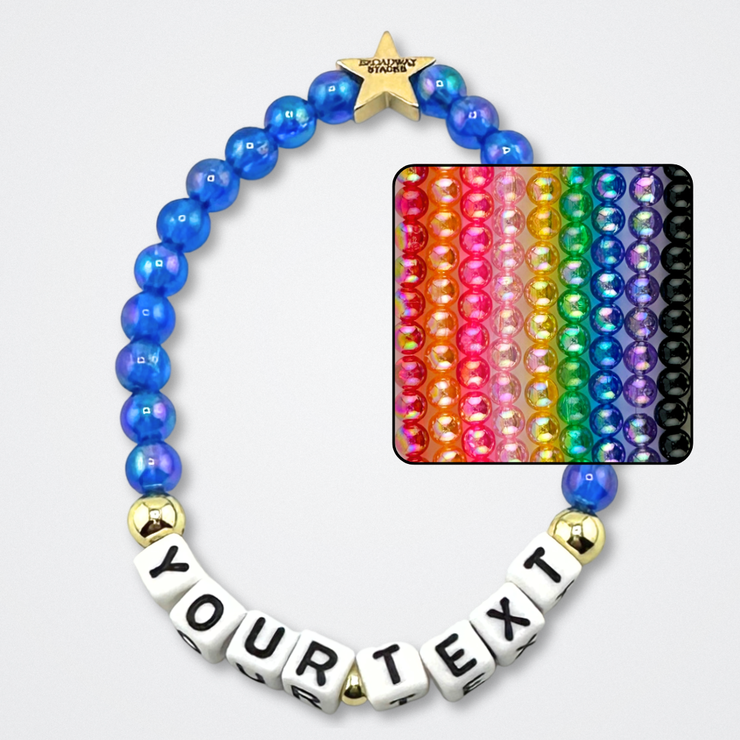 Broadway Stacks rainbow colors elastic stretch bracelets with gold color accents. Letter beads spell out YOUR TEXT, for custom bracelet. Gold star logo bead to remind you that You Shine. Available in 9 different colors. Displayed on a gray background.