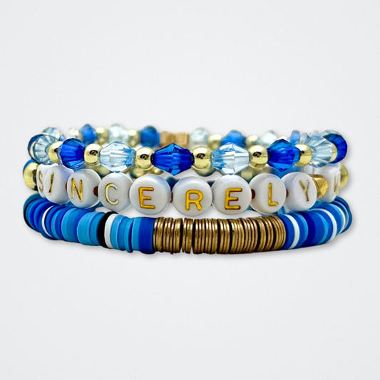 Broadway Stacks SKY collection. 3 stretch bracelets included in Stack. Blues, white, black and gold colored beads. Letter beads that spell quotes. Gold star logo bead to remind you that You Shine. Dear Evan Hansen DEH fans.
