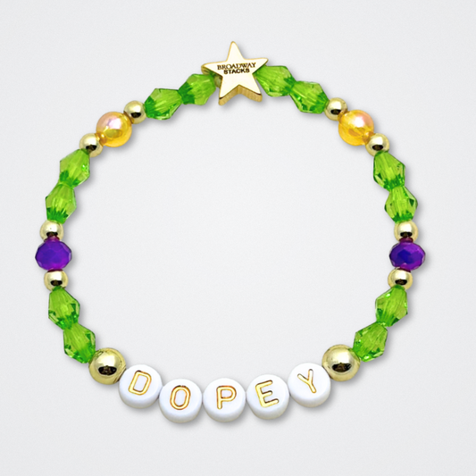 Broadway Stacks Special Edition bracelet. Green, yellow, purple and gold beads. Letter beads that spell Dopey. A portion of the proceeds go to Gilana's Fund. Gold star logo bead to remind you that you shine.