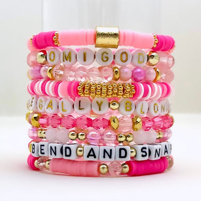 Broadway Stacks Legally Blonde collection. 3 stretch bracelets included in Stack. Pinks, white and gold colored beads. Letter beads that spell Legally Blonde.