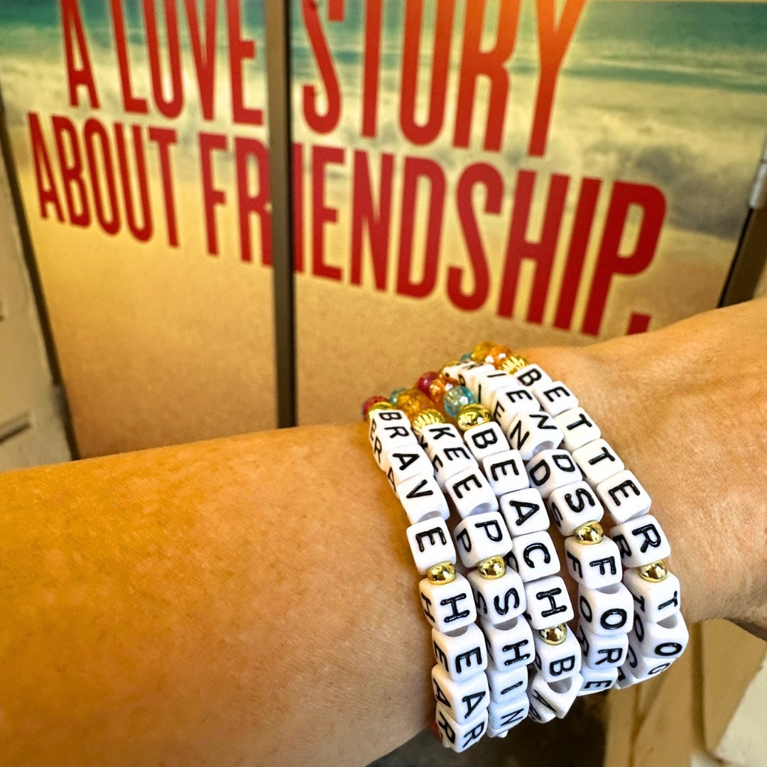Broadway Stacks BETTER TOGETHER Collection. 5 stretch bracelets included in Stack. Black, white, red, blue, orange, yellow and gold colored beads. Letter beads that spell quotes. Star logo bead to remind you that you shine. Beaches the Musical fans.