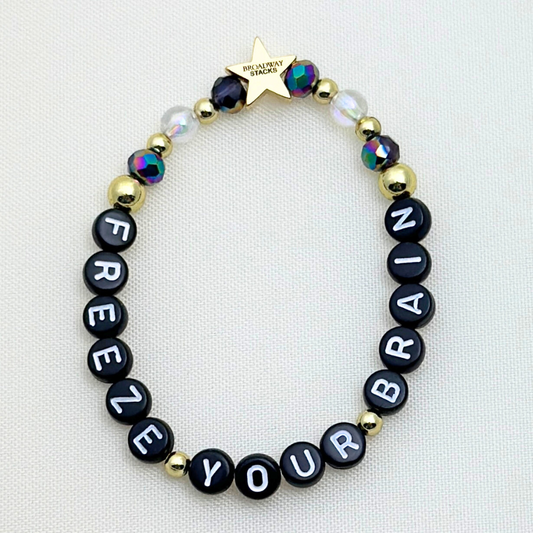 Broadway Stacks CORN NUTS Collection. 5 stretch bracelets included in Stack. Red, yellow, green, blue, black and gold colored beads. Letter beads that spell quotes. Gold star logo bead to remind you that you shine. Heathers the Musical fans.