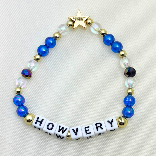 Broadway Stacks CORN NUTS Collection. 5 stretch bracelets included in Stack. Red, yellow, green, blue, black and gold colored beads. Letter beads that spell quotes. Gold star logo bead to remind you that you shine. Heathers the Musical fans.