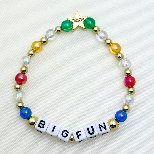 Broadway Stacks CORN NUTS Collection. 5 stretch bracelets included in Stack. Red, yellow, green, blue, black and gold colored beads. Letter beads that spell quotes. Gold star logo bead to remind you that you shine. Heathers the Musical fans.