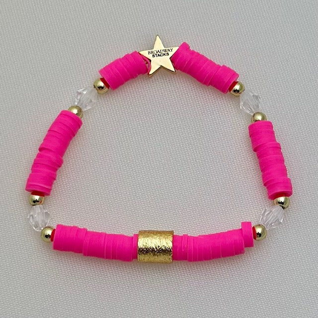 Broadway Stacks POTUS collection. 3 stretch bracelets included in Stack. Pinks, white, blue, golds and black colored beads. Letter beads that spell show quotes. Broadway Stacks gold star logo bead on back.