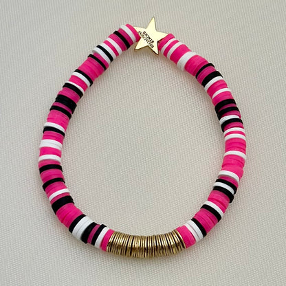 Broadway Stacks POTUS collection. 3 stretch bracelets included in Stack. Pinks, white, blue, golds and black colored beads. Letter beads that spell show quotes. Broadway Stacks gold star logo bead on back.