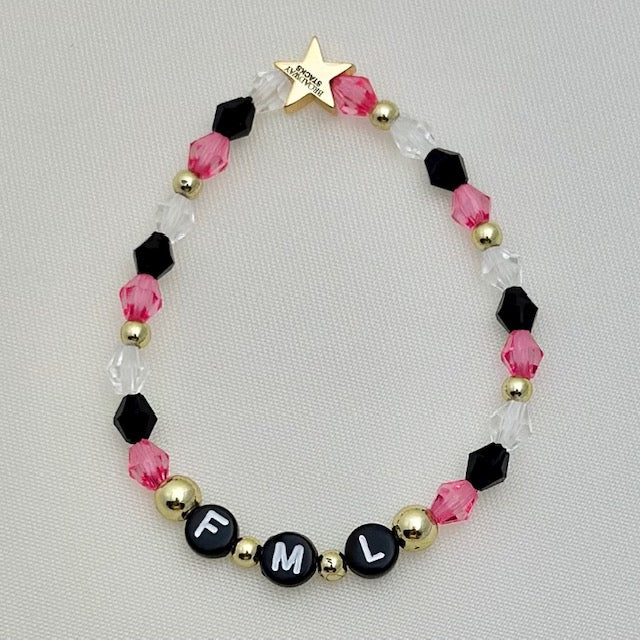 Broadway Stacks POTUS collection. 3 stretch bracelets included in Stack. Pinks, white, blue, golds and black colored beads. Letter beads that spell show quotes. Broadway Stacks gold star logo bead on back.