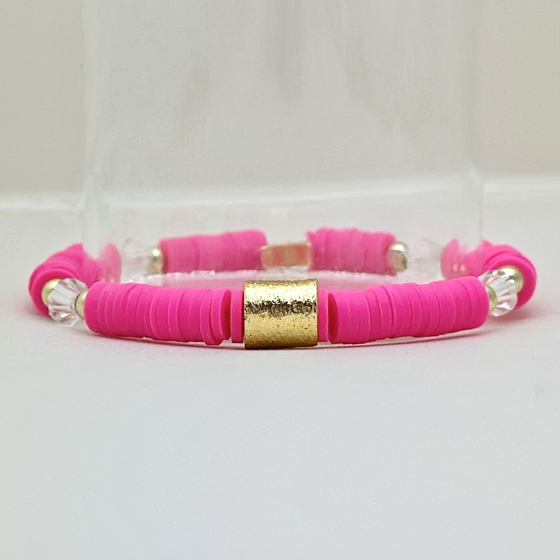 Broadway Stacks POTUS collection. 3 stretch bracelets included in Stack. Pinks, white, blue, golds and black colored beads. Letter beads that spell show quotes. Broadway Stacks gold star logo bead on back.