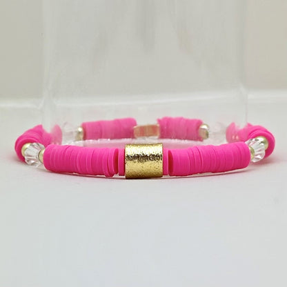 Broadway Stacks POTUS collection. 3 stretch bracelets included in Stack. Pinks, white, blue, golds and black colored beads. Letter beads that spell show quotes. Broadway Stacks gold star logo bead on back.