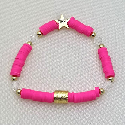 Broadway Stacks POTUS collection. 3 stretch bracelets included in Stack. Pinks, white, blue, golds and black colored beads. Letter beads that spell show quotes. Broadway Stacks gold star logo bead on back.