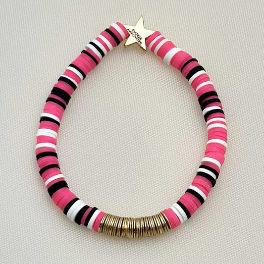 Broadway Stacks POTUS collection. 3 stretch bracelets included in Stack. Pinks, white, blue, golds and black colored beads. Letter beads that spell show quotes. Broadway Stacks gold star logo bead on back.