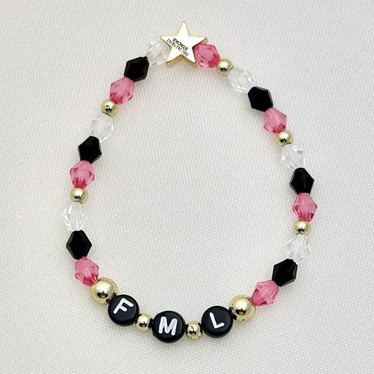 Broadway Stacks POTUS collection. 3 stretch bracelets included in Stack. Pinks, white, blue, golds and black colored beads. Letter beads that spell show quotes. Broadway Stacks gold star logo bead on back.