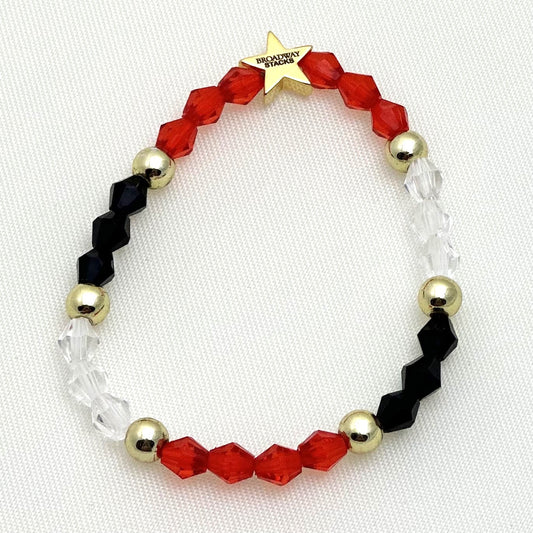 Broadway Stacks MASK collection. 3 stretch bracelets included in Stack. Red, white, gold and black colored beads. Letter beads that spell show quotes. Broadway Stacks gold star logo bead on back.