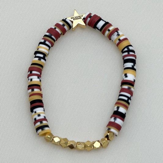 Broadway Stacks SAFARI collection. 3 stretch bracelets included in Stack. Reds, oranges, yellows, black, gold and animal print colored beads. Letter beads that spell show quotes. Broadway Stacks gold star logo bead on back.