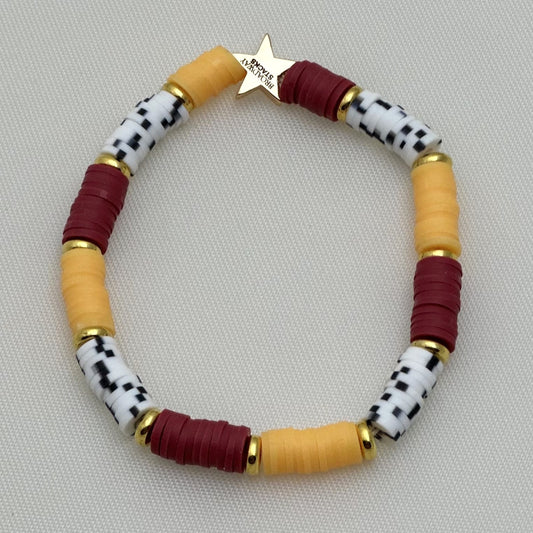 Broadway Stacks SAFARI collection. 3 stretch bracelets included in Stack. Reds, oranges, yellows, black, gold and animal print colored beads. Letter beads that spell show quotes. Broadway Stacks gold star logo bead on back.