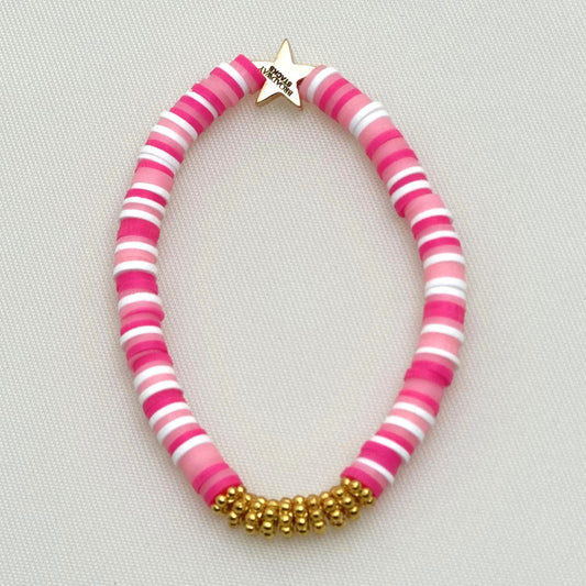 Broadway Stacks KEEP IT POSITIVE collection. 3 stretch bracelets included in Stack. Pinks, white, and gold colored beads. Letter beads that spell show quotes. Broadway Stacks gold star logo bead on back.