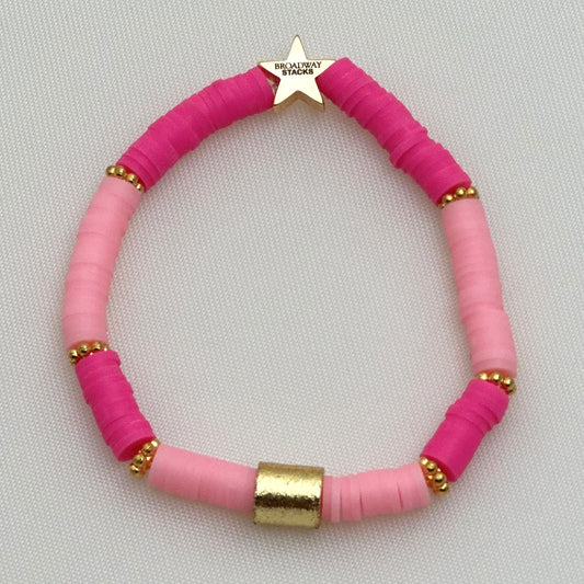 Broadway Stacks KEEP IT POSITIVE collection. 3 stretch bracelets included in Stack. Pinks, white, and gold colored beads. Letter beads that spell show quotes. Broadway Stacks gold star logo bead on back.