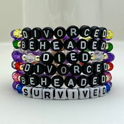 Broadway Stacks HerStory Stack. 6 Stretch bracelets included in Stack. Divorced, beheaded, died, divorced, beheaded, survived. Gold, yellow, green, white, red, pink and blue colored beads. Broadway Stacks gold star logo bead on back.