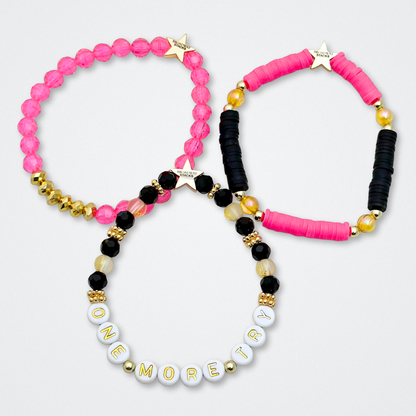 Broadway Stacks De Bois Band collection. 3 stretch bracelets included in Stack. Pinks, golds and black colored beads. Letter beads that spell quotes. Broadway Stacks gold star logo bead to remind you that you shine. & Juliet fans.