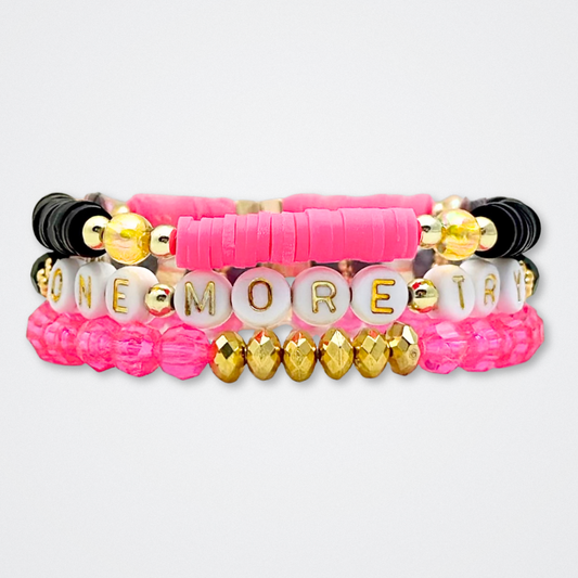 Broadway Stacks De Bois Band collection. 3 stretch bracelets included in Stack. Pinks, golds and black colored beads. Letter beads that spell quotes. Broadway Stacks gold star logo bead to remind you that you shine. & Juliet fans.