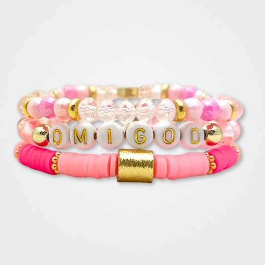 Broadway Stacks KEEP IT POSITIVE Collection. 9 stretch bracelets included in Stack. Pinks, white and gold colored beads. Letter beads that spell quotes. Gold star logo bead to remind you that you shine. Legally Blonde fans. 