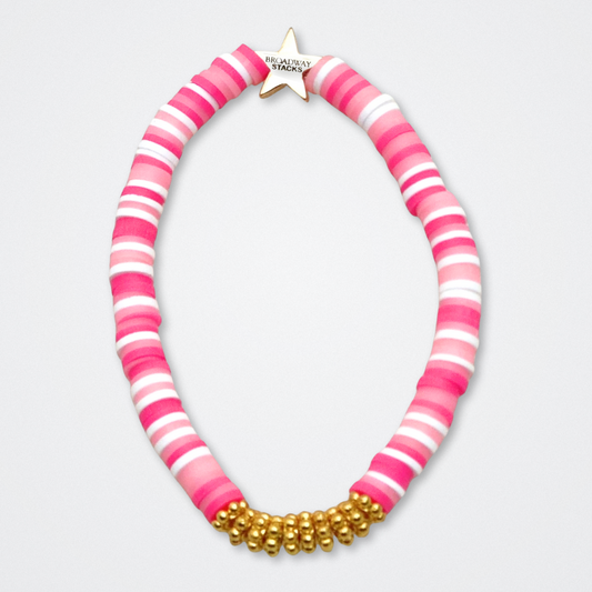 Broadway Stacks KEEP IT POSITIVE Collection. 9 stretch bracelets included in Stack. Pinks, white and gold colored beads. Letter beads that spell quotes. Gold star logo bead to remind you that you shine. Legally Blonde fans. 