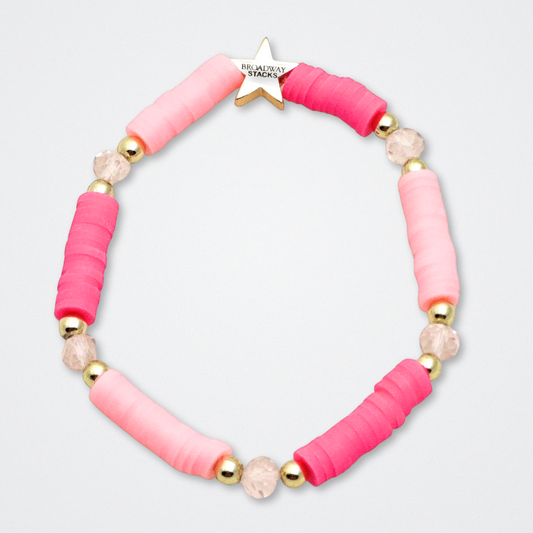 Broadway Stacks KEEP IT POSITIVE Collection. 9 stretch bracelets included in Stack. Pinks, white and gold colored beads. Letter beads that spell quotes. Gold star logo bead to remind you that you shine. Legally Blonde fans. 