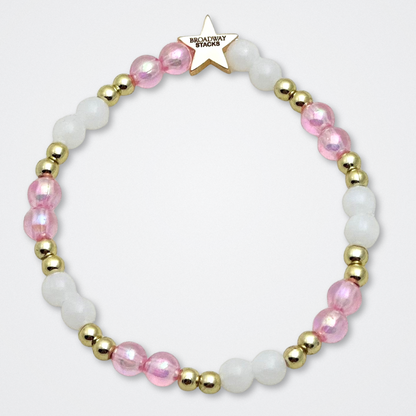 Broadway Stacks KEEP IT POSITIVE Collection. 9 stretch bracelets included in Stack. Pinks, white and gold colored beads. Letter beads that spell quotes. Gold star logo bead to remind you that you shine. Legally Blonde fans. 