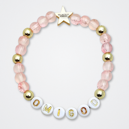 Broadway Stacks KEEP IT POSITIVE Collection. 9 stretch bracelets included in Stack. Pinks, white and gold colored beads. Letter beads that spell quotes. Gold star logo bead to remind you that you shine. Legally Blonde fans. 