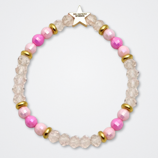 Broadway Stacks KEEP IT POSITIVE Collection. 9 stretch bracelets included in Stack. Pinks, white and gold colored beads. Letter beads that spell quotes. Gold star logo bead to remind you that you shine. Legally Blonde fans. 