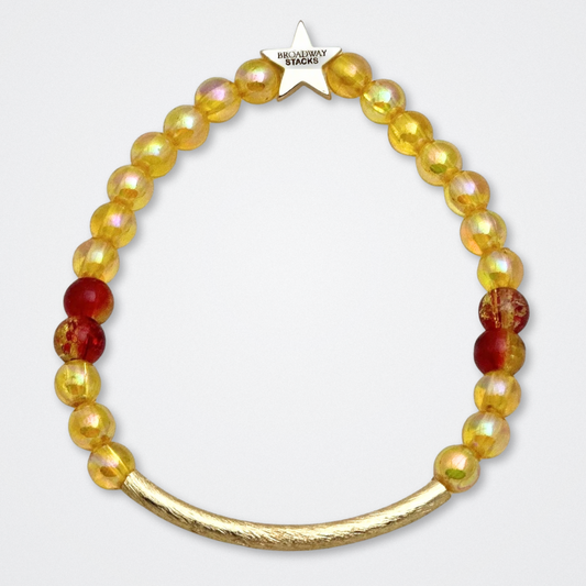 Broadway Stacks SAFARI collection. 3 stretch bracelets included in Stack. Dark reds, yellow, orange, white, black and gold colored beads. Animal print beads as well. Letter beads that spell quotes, Gold star logo bead to remind you that you shine.