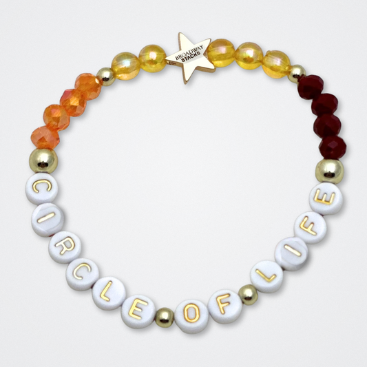Broadway Stacks SAFARI collection. 3 stretch bracelets included in Stack. Dark reds, yellow, orange, white, black and gold colored beads. Animal print beads as well. Letter beads that spell quotes, Gold star logo bead to remind you that you shine.