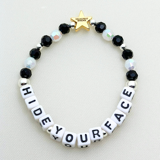 Broadway Stacks MASQUERADE Collection. 4 stretch bracelets included in Stack. Black, white and silver colored beads. Letter beads that spell quotes. Gold star logo bead to remind you that you shine. Phantom of the Opera and Masquerade NYC fans.