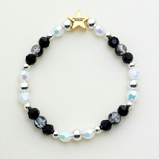 Broadway Stacks MASQUERADE Collection. 4 stretch bracelets included in Stack. Black, white and silver colored beads. Letter beads that spell quotes. Gold star logo bead to remind you that you shine. Phantom of the Opera and Masquerade NYC fans.
