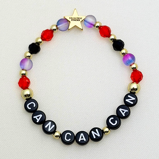 Broadway Stacks RED LIGHT Collection. 5 stretch bracelets included in Stack. Red, purple, black and gold colored beads. Letter beads that spell quotes. Gold star logo bead to remind you that you shine. Moulin Rouge fans. 