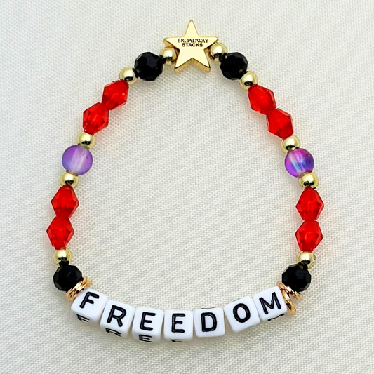 Broadway Stacks RED LIGHT Collection. 5 stretch bracelets included in Stack. Red, purple, black and gold colored beads. Letter beads that spell quotes. Gold star logo bead to remind you that you shine. Moulin Rouge fans. 