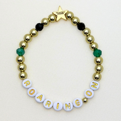 Broadway Stacks NEW MONEY Collection. 5 stretch bracelets included in Stack. Teal, black and gold colored beads. Letter beads that spell quotes. Gold star logo bead to remind you that you shine.